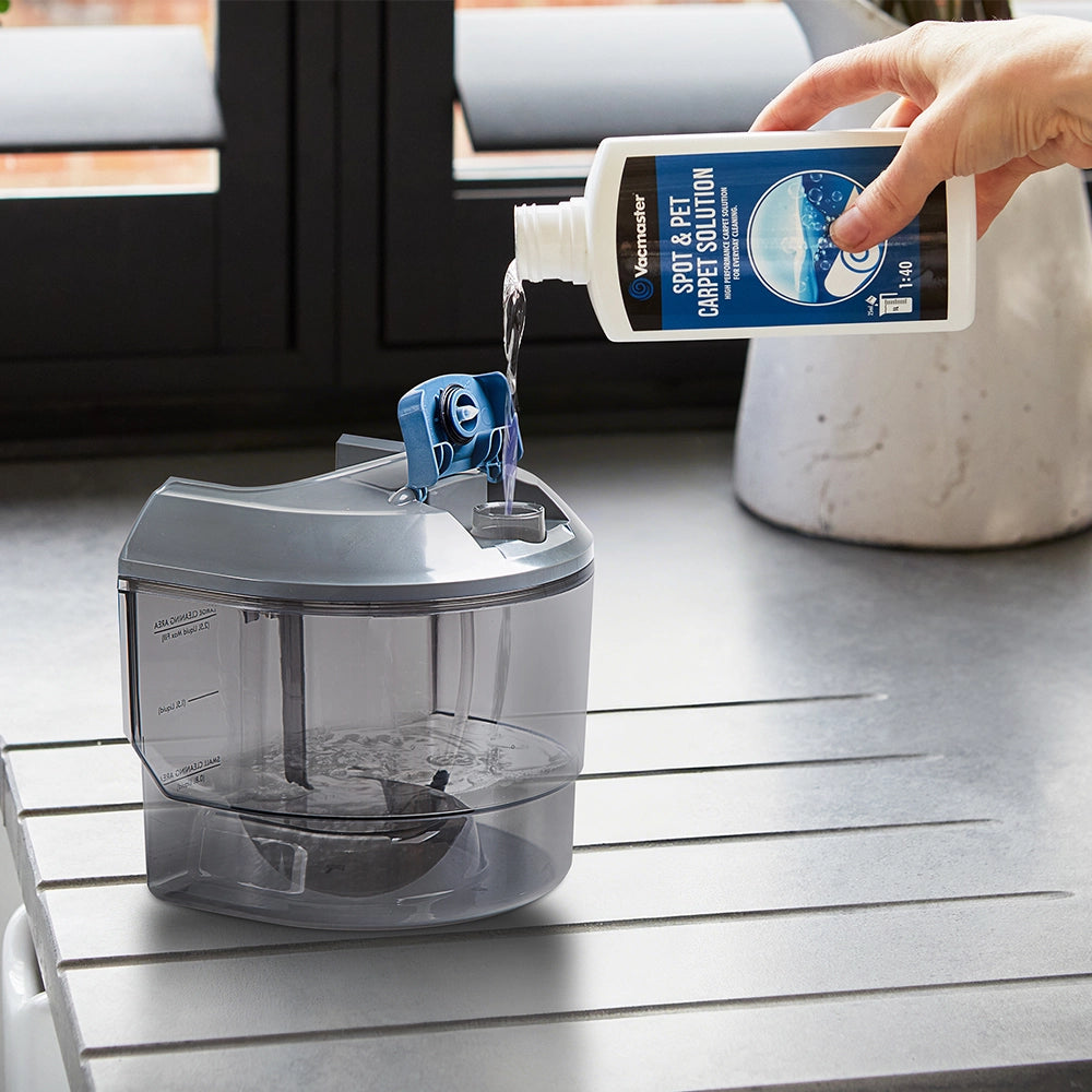 Pouring_Vacmaster_Spot_and_Pet_Carpet_Solution_into_the_EasyClean_Rapid_replacement_clean_water_tank_tank_part_952870