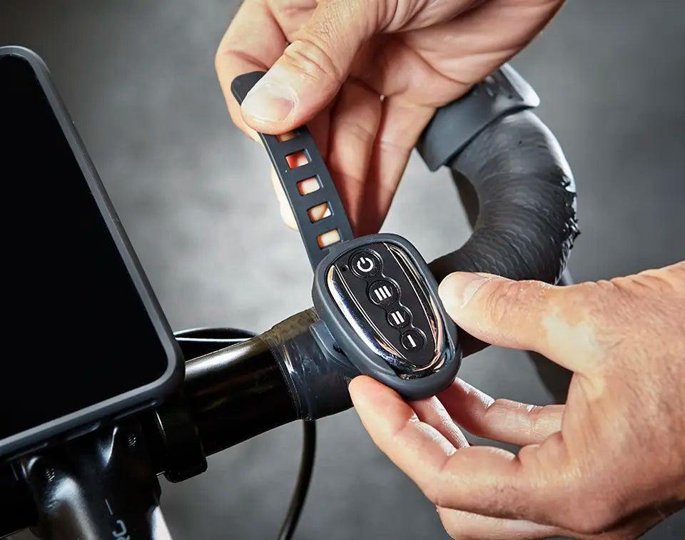 Vacmaster_Cardio54_Fan_Remote Control being attached to turbo trainer bike handlebar AM120R_03