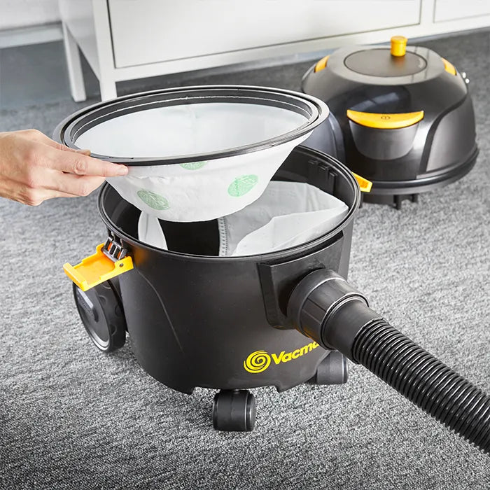 Cylinder vacuum cleaner dust bag and HEPA filter being fitted in Vacmaster D8