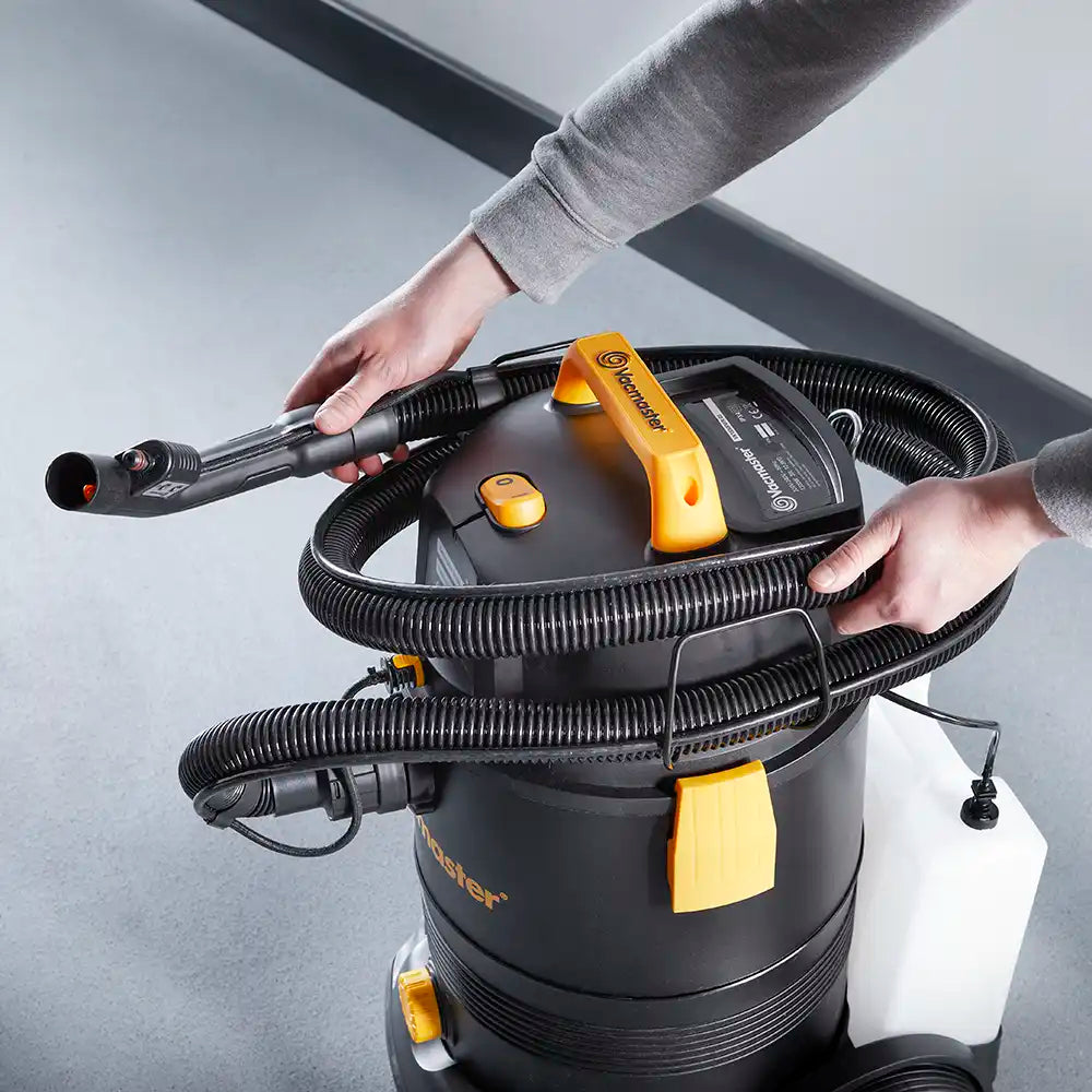 Wet dry vacuum cleaner and carpet washer hose being stored in vacuum VK1330PWR-03
